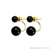 Double pearl earrings, gold colored with black beads